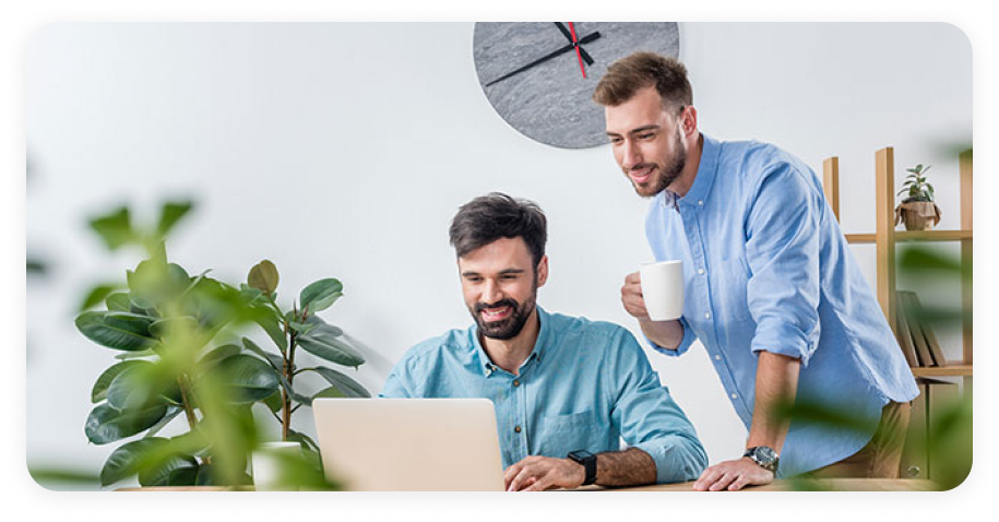 2 man watching laptop